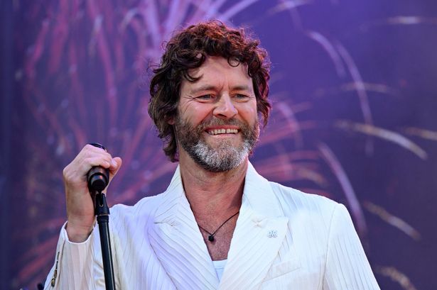 Howard Donald poses with rarely-seen sons and daughters in lavish London home