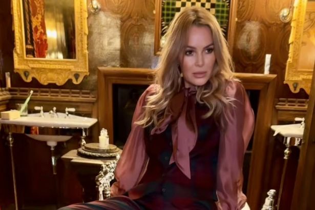 Amanda Holden proudly poses with rarely-seen lookalike daughters