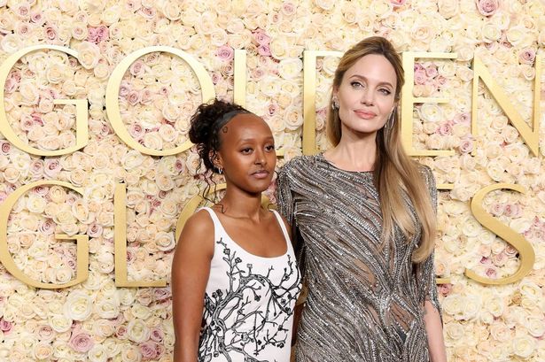 Angelina Jolie’s daughter Zahara reveals her 28 piercings on Golden Globes red carpet