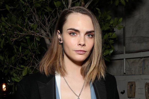 Cara Delevigne sparks confusion as she showcases huge pregnant belly