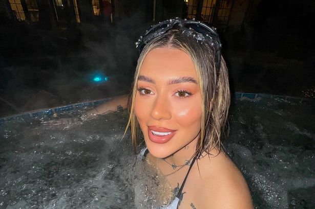 TOWIE’s Demi Sims flaunts multiple back and arm tattoos as she poses in hot tub