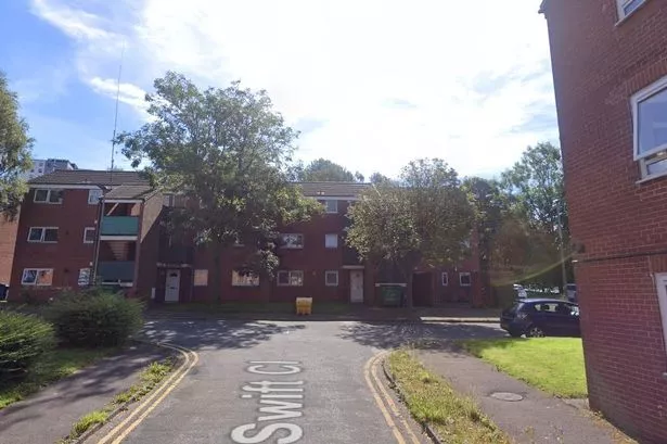 Police swarm residential street in Blackburn after two men stabbed