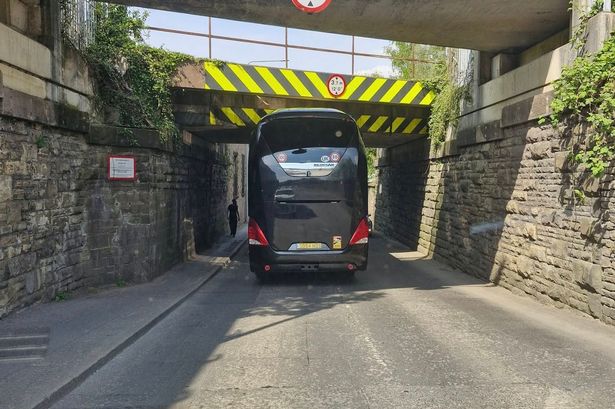 Coach hits Accrington railway bridge during rush hour traffic