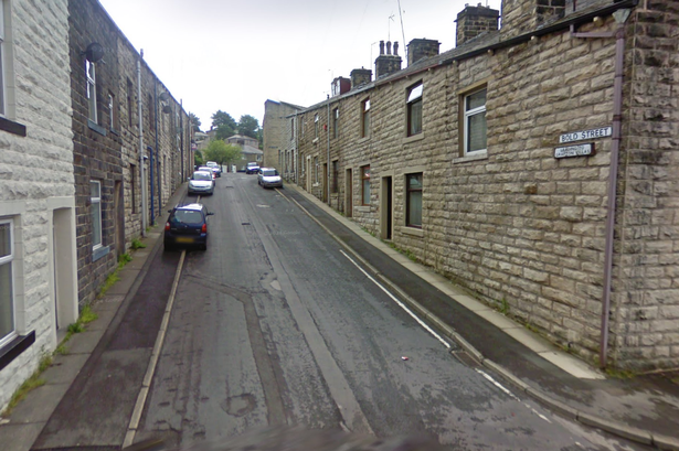 Police descend on residential street after man stabbed in stomach