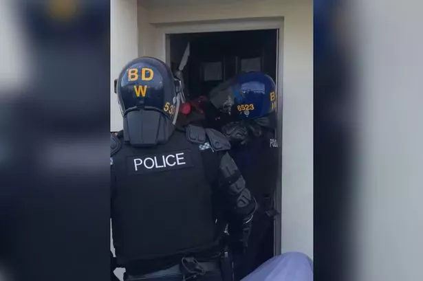 Moment police smash through Fleetwood house as man and woman arrested in drug raid