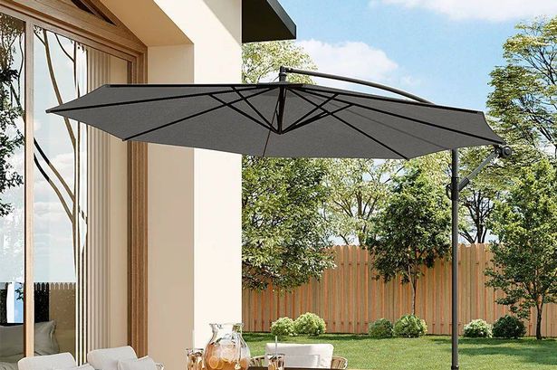 Debenhams slashes giant garden umbrella from £470 to £130 ready for the heatwave