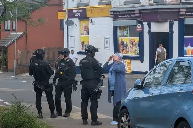Live updates as armed cops called to Blackburn street