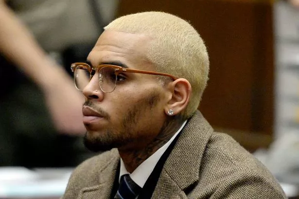 Chris Brown remanded in custody after appearing in court charged over ‘bottle attack’