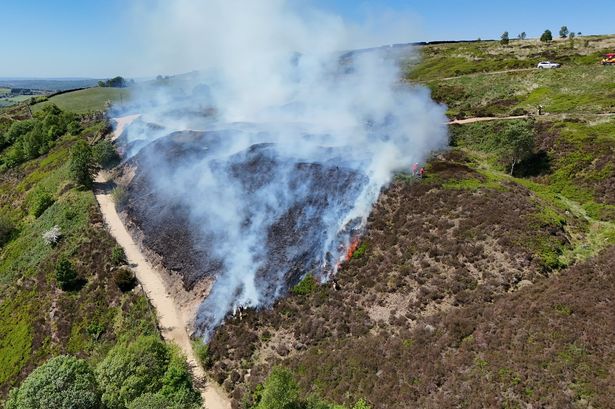 Hillside left scorched after wildfire breaks out with smoke seen for miles