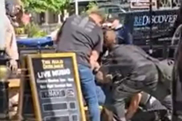 Moment police with face coverings detain ‘the wrong guy’ outside pub