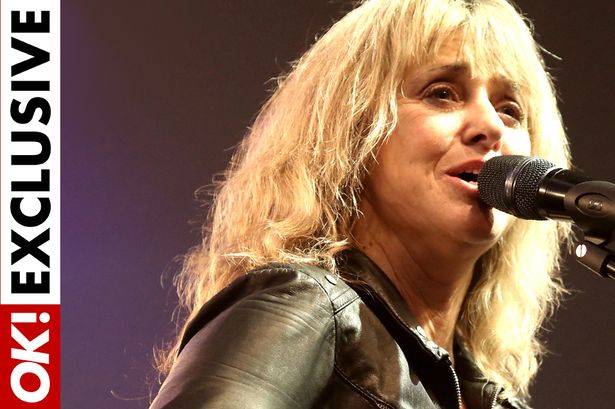 Pop icon Suzi Quatro crying as crazed fan grabs her and tries to pull off stage