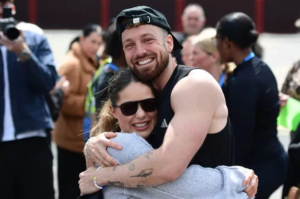 Sam Thompson embraced by sister Louise as he emotionally completes gruelling Soccer Aid challenge