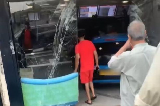 Car ploughs through front of Blackburn takeaway in horror crash