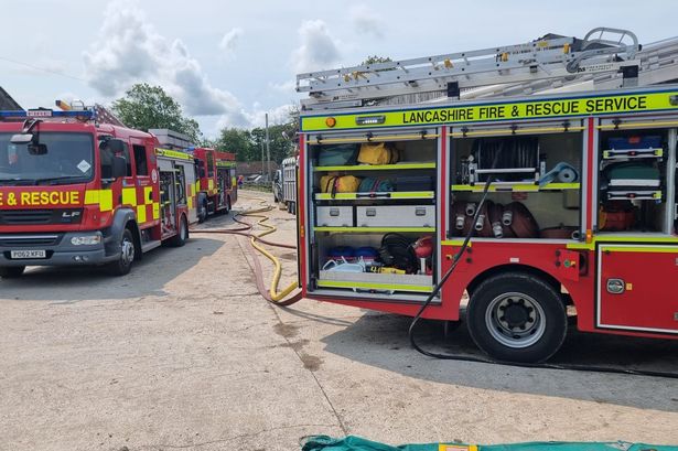 Fire crews battle huge barn blaze as bales of hay go up in flames