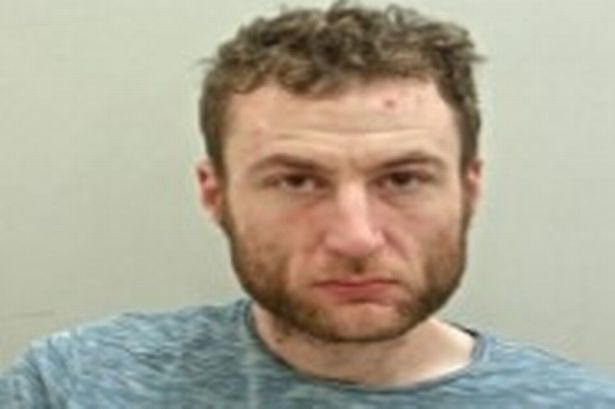 Police release mugshot in appeal to track down wanted man