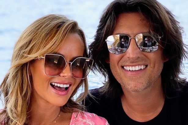 Amanda Holden does one thing twice a year ‘to prove husband exists’