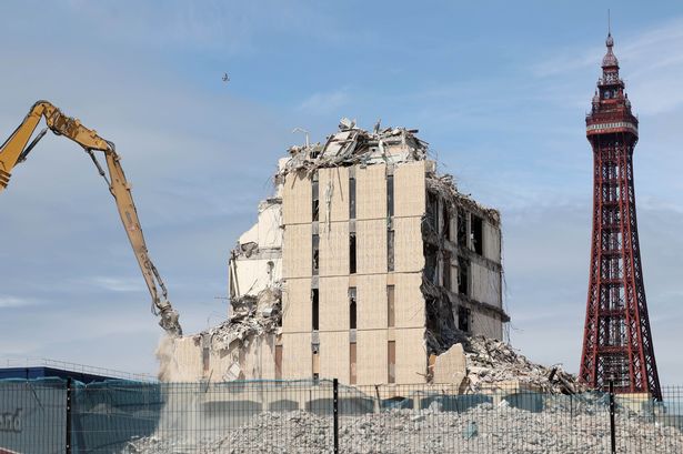 Incredible images show demolition of former police station as dust fills the air