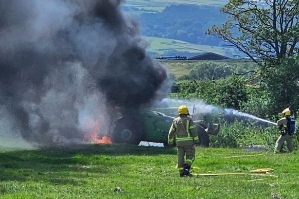 Dramatic scenes in Lancashire field as telehandler bursts into flames
