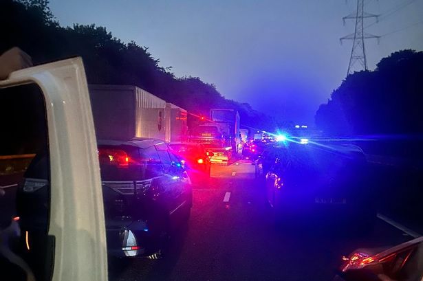 M61 crash shuts motorway for hours after biker ‘trying to escape police’ hits car