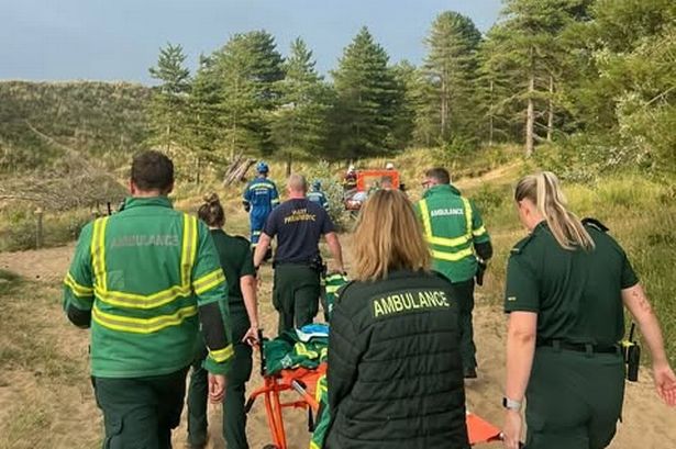 Casualty rushed to hospital after falling ‘significant distance down sand dune’