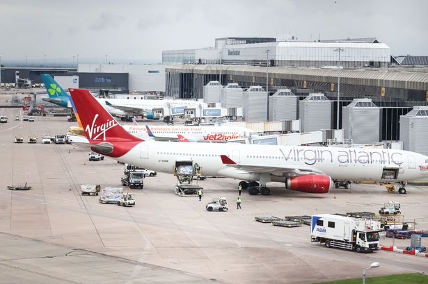 Manchester Airport flight grounded after woman ‘tries to open emergency exit’