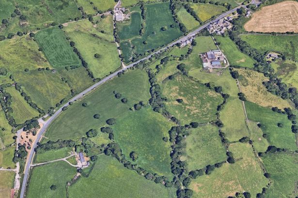 Busy road closed with police at scene after three-vehicle smash near farm