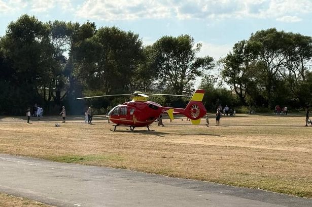 Air ambulance lands near promenade after man pulled from water