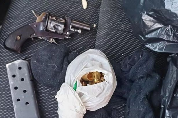 Gun and bullets found in car as man and woman arrested