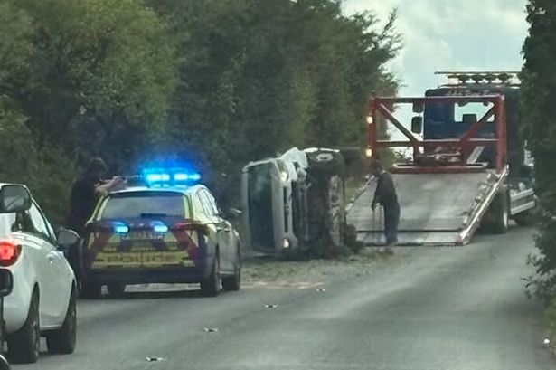 Dramatic moment van flips onto its side in crash as police shut road