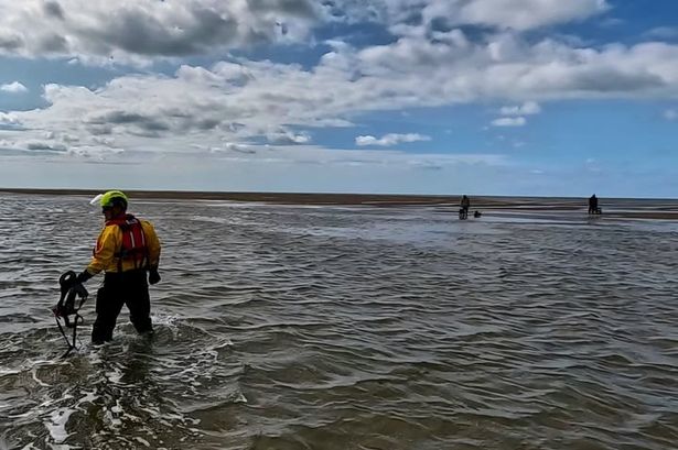 Four dogs and two people rescued after being ‘cut off by the tide’