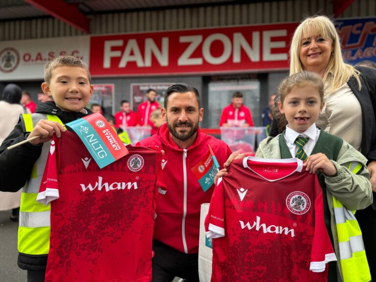 Football club landmark as more than 10,000 shirts handed out to children