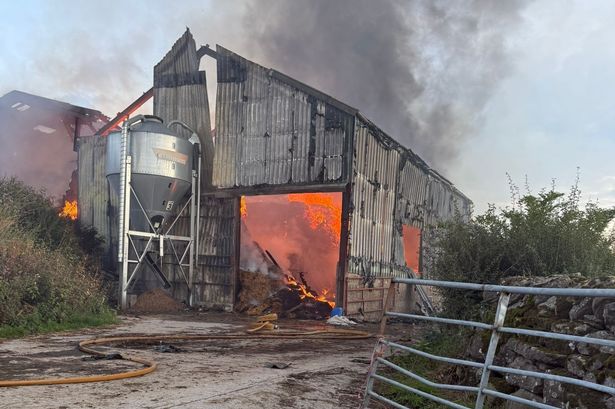 Eight fire engines battle huge blaze using water pumped from river across fields
