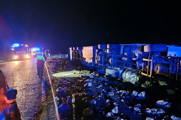 Dramatic crash leaves lorry overturned in field as emergency crews descend