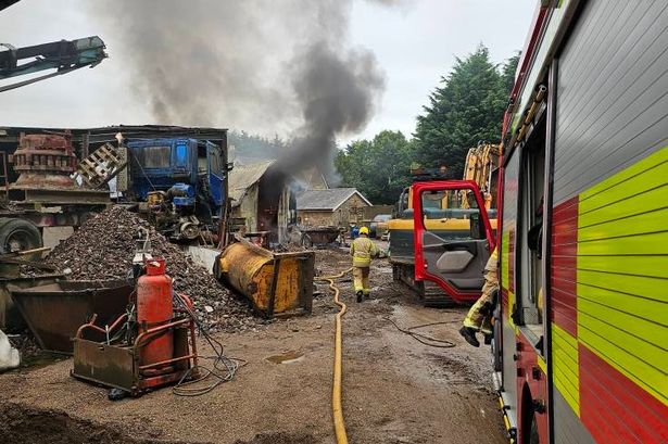 Huge fire breaks out involving outbuilding and diesel tanks as six fire crews rush to scene