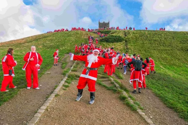 Nearly 2,000 Santas, a big hill and a tradition that ‘gets better and better every year’