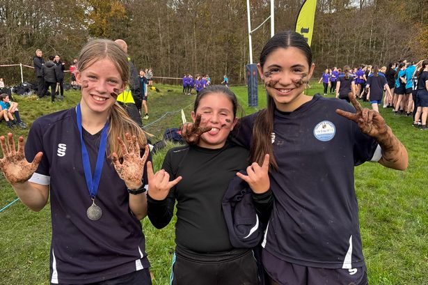 Lost shoes, slips and skids as 400 cross-country runners do battle in the mud
