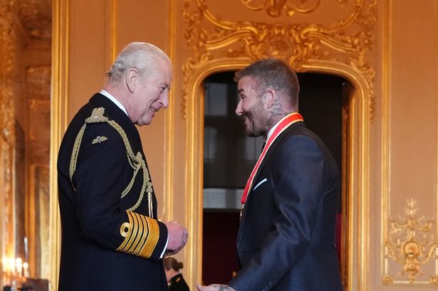 David Beckham finally receives knighthood from King Charles as proud wife Victoria looks on – see pics