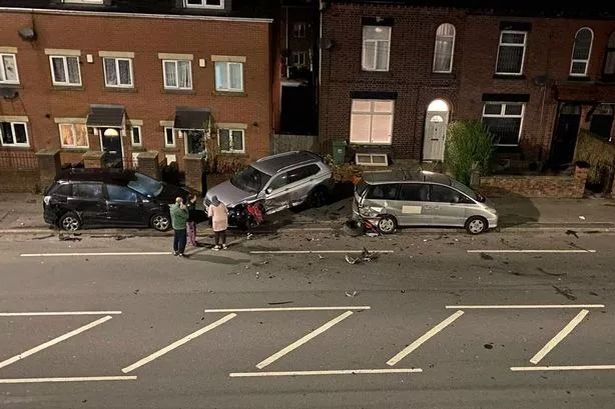 Scene of destruction left on road after car ploughs into three parked vehicles
