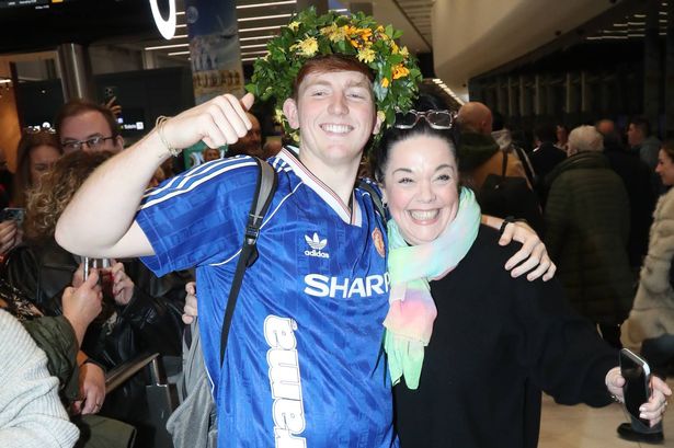 Angry Ginge mobbed by fans as he lands in Manchester wearing jungle crown after I’m A Celeb