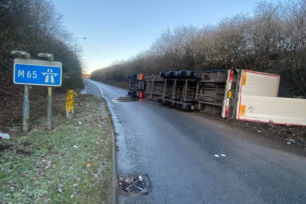 Hunt for driver of stolen lorry after it flipped on M65 slip road