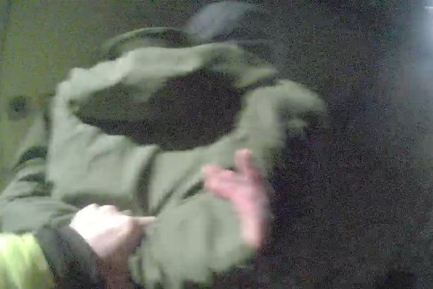 Man arrested after police notice ‘vehicle lights flashing and door open’