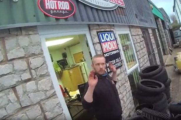 Dramatic moment armed police storm gun factory hidden inside motorbike garage