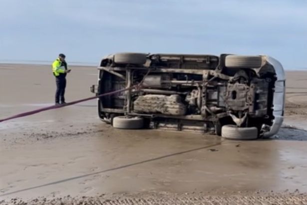 Car flips onto its side in Morecambe Bay beach crash as ‘fun turns into disaster for youths’