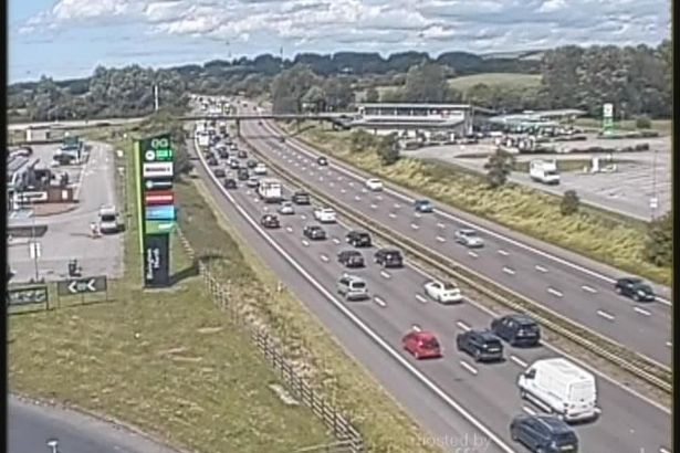 M61 traffic LIVE as crash causes HOUR-long delays and miles of queues