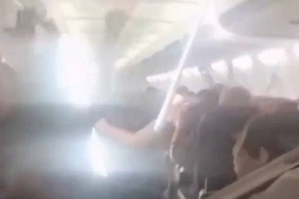 Plane’s ceiling collapses as passengers scream in horror during emergency landing