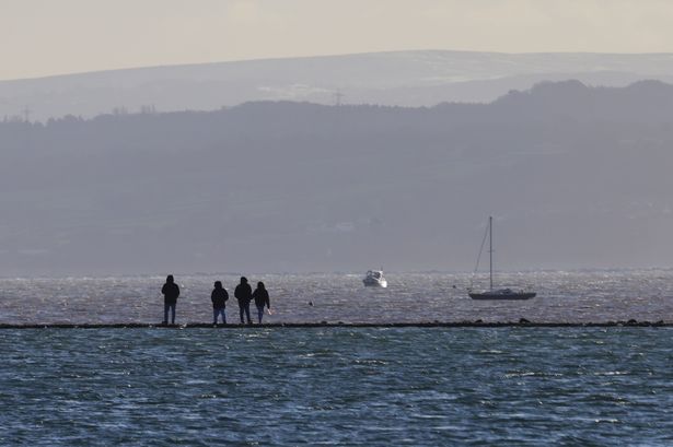 Body of man found washed up on rocks as death ‘unexplained’ police say