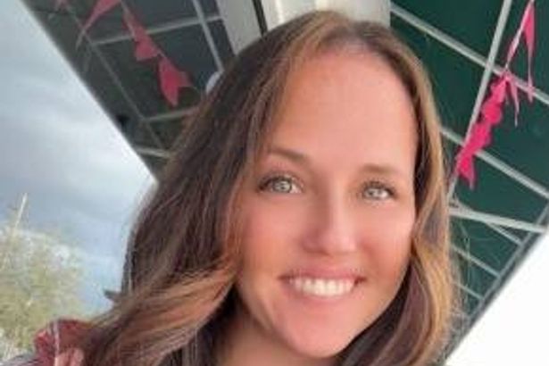Mum grins in mugshot after ‘caught having sex with family dog by husband’