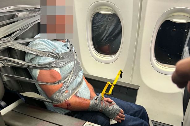 Passenger duct-taped to seat after American Airlines flight descends into chaos