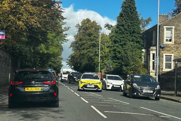 Police explain why car with flashing lights was left in middle of Darwen main road